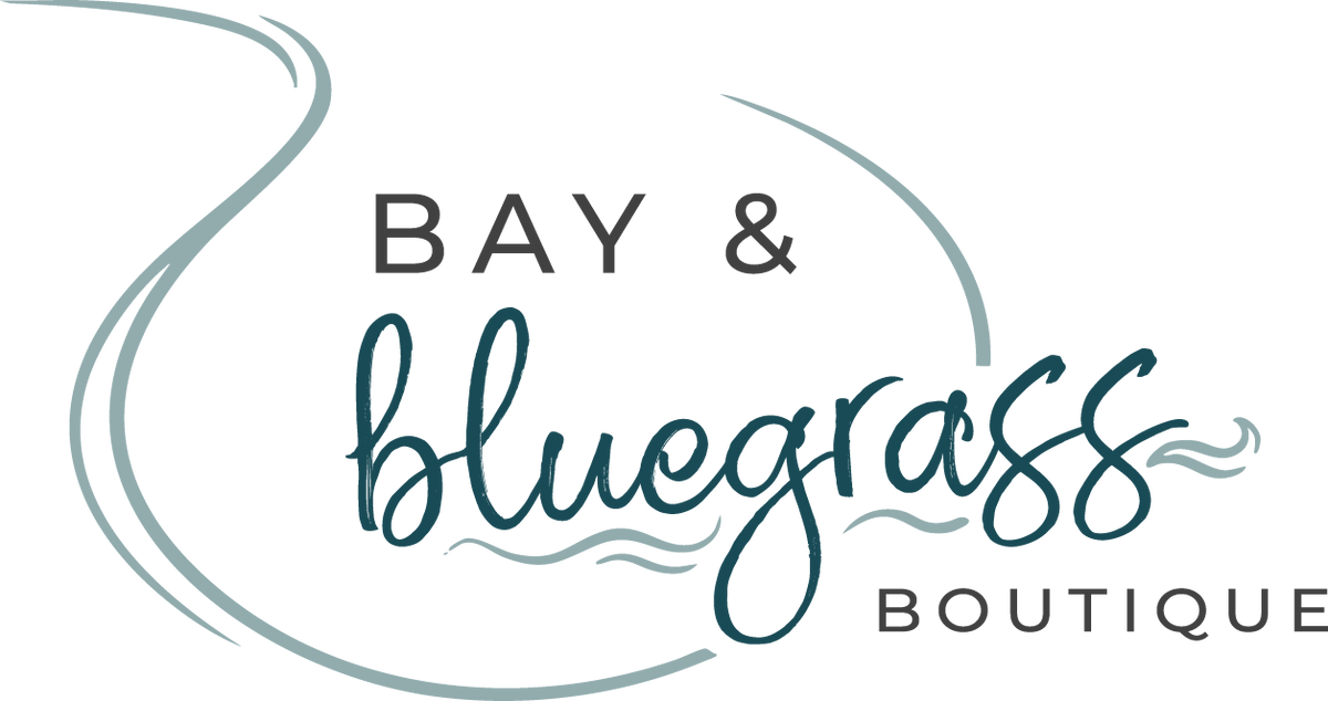 A logo-style graphic reading 'BAY & bluegrass BOUTIQUE' on a white background, with dark gray and teal lettering and curved line accents.