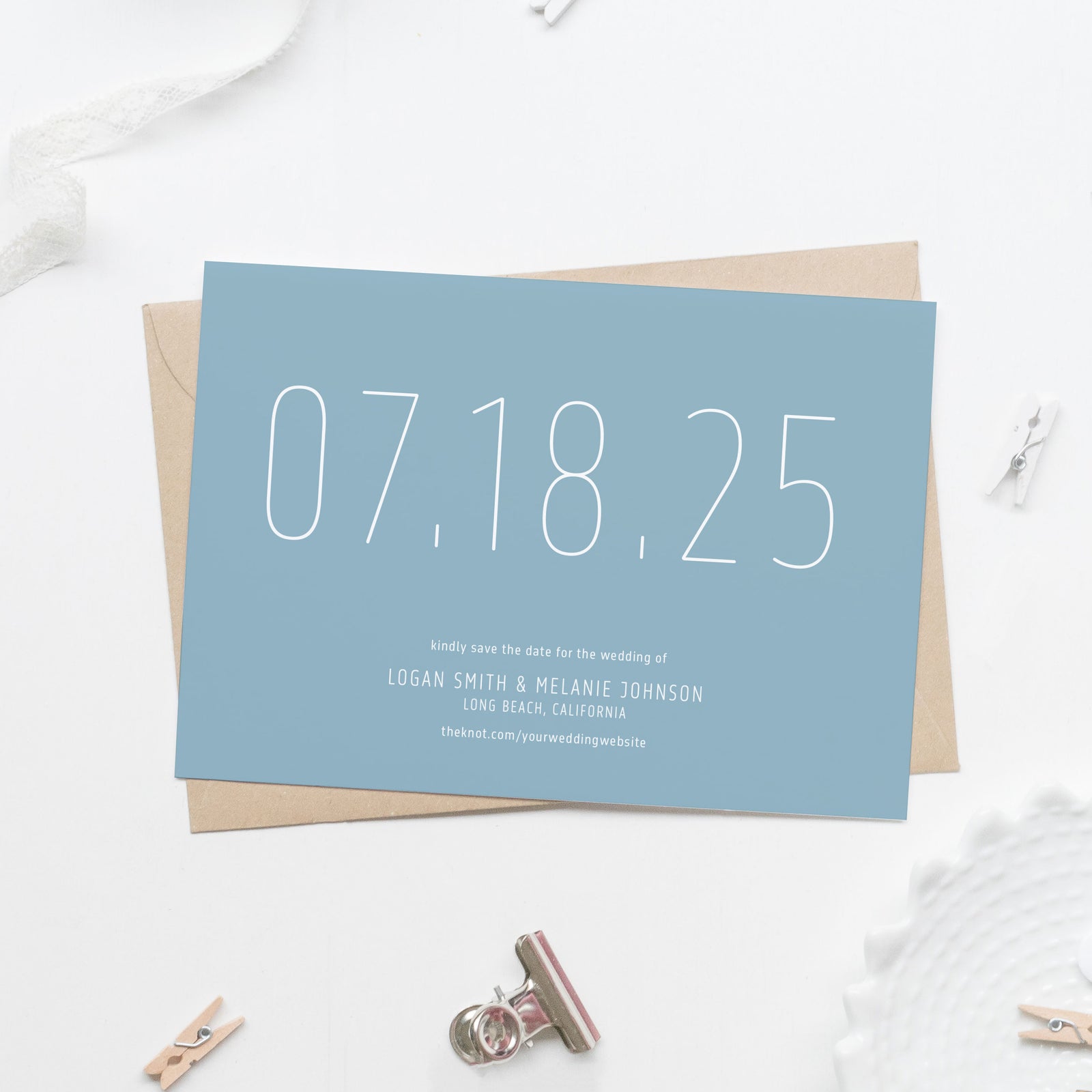 light blue save the date card in white sans serif skinny font with large date