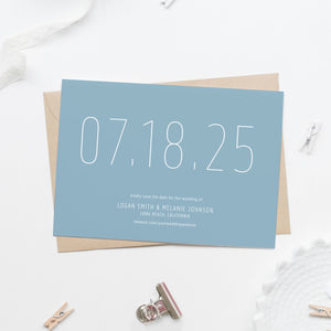 light blue save the date card in white sans serif skinny font with large date