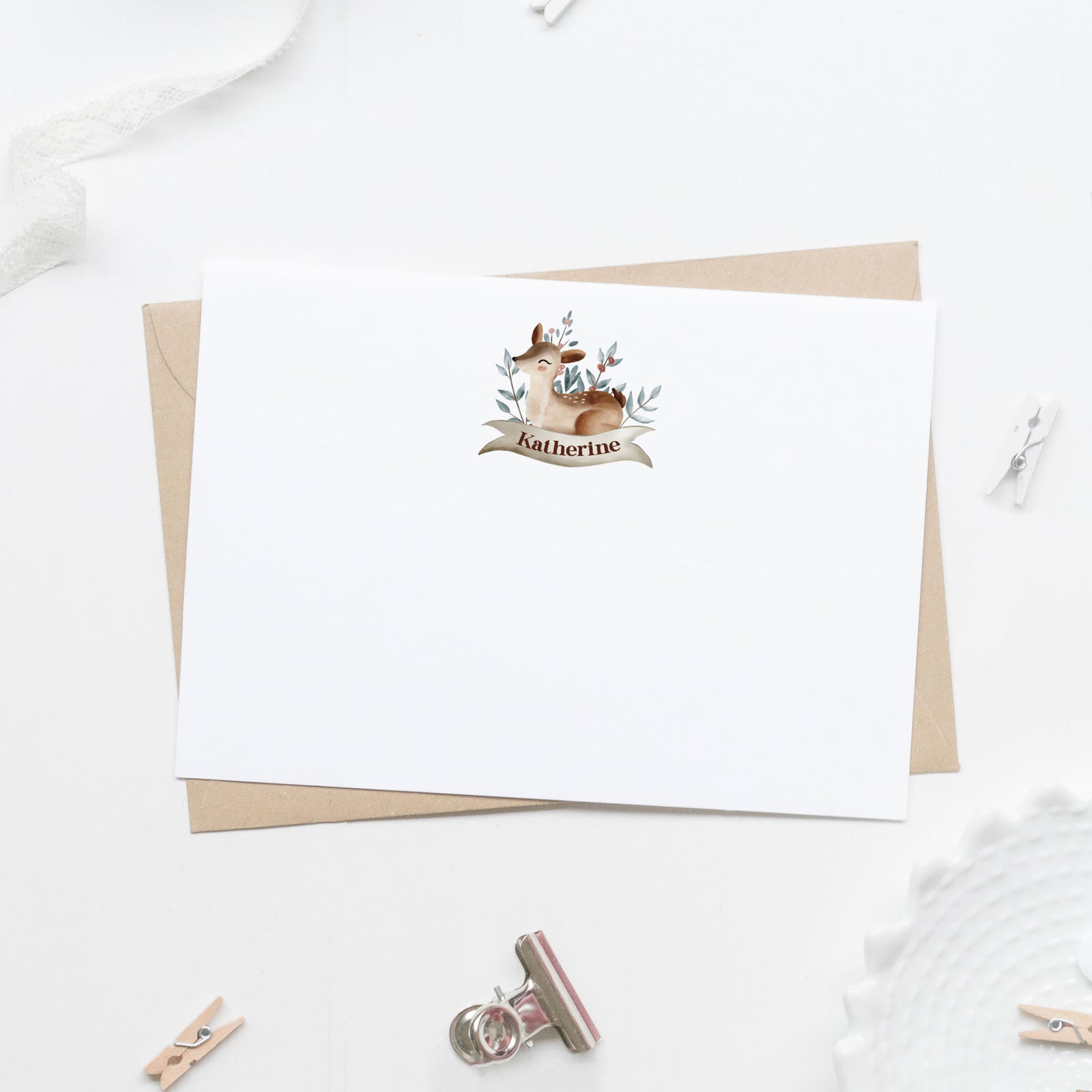 Watercolor fawn laying on tan banner with personalized name stationery cards